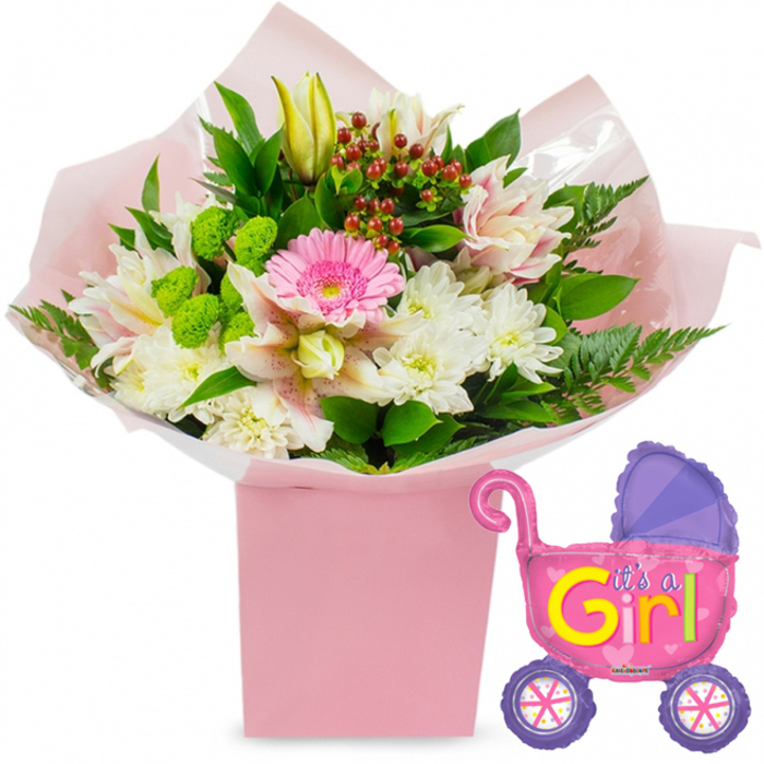 A charming new baby girl gift ensemble is set against a simple white background, where every colour, reflection, and petal texture is easy to see and imagine. At its centre stands a tall, square light-pink gift box, acting as a decorative base rather than a traditional vase. From this box rises a lush, carefully arranged bouquet that looks as though it might have just been delivered to a Stanmore doorstep. A soft yet vivid pink gerbera daisy sits prominently in the middle, its open face instantly drawing the viewer's eye. Around it cluster pristine white chrysanthemums, their numerous narrow petals creating a plush, cushion-like effect, while elegant alstroemeria lilies with pale pink and white speckled petals add gentle curves and a hint of refined patterning. A closed yellow lily bud peeks out from the upper portion of the arrangement, introducing a vertical line and symbolising unfolding days and milestones for the baby girl. The design is enriched by bright lime-green button blooms that provide lively texture, and by glossy, dark green leaves and feathery fern fronds that frame the softer petals and give the bouquet depth and structure. Deep red hypericum berries are tucked thoughtfully between the flowers, offering small pops of colour that feel both festive and warm. The bouquet is wrapped in soft pink tissue paper and a layer of clear cellophane, their folds neatly gathered into the box so that the presentation looks polished yet tender. To the right of the flowers floats a foil balloon shaped like a classic baby stroller. The balloon shimmers in hot pink, its domed hood a deeper purple, and its two purple wheels decorated with colourful spokes in playful shades of pink, yellow, blue, and purple. Bold, bubbly lettering in bright yellow and green announces It's a Girl! across the side, surrounded by tiny pink heart details. Together, the bouquet and balloon set create a joyful tableau that would look perfectly at home in a Stanmore nursery or living room, ideal for baby shower centrepieces, hospital deliveries, or thoughtful gifts welcoming a newborn daughter to the neighbourhood.