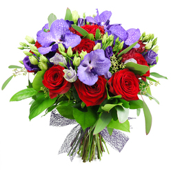 This bouquet tells a story of contrast and harmony, crafted by a Stanmore florist for a client seeking a grand surprise. The plush red roses provide a warm heartbeat, their velvety petals curling into perfect spirals, while the purple Vanda orchids rise like poised wings, their broad, speckled petals catching lamplight. Nestled among them, lisianthus in soft purples dance in bud and bloom, offering gentle lavender tones that glow against the deeper hues. The greenery is lush and varied, with broad dark leaves and slender sprigs that give the arrangement volume and a sense of wild growth. Some green buds wait just beneath the surface, hinting at new life, and tiny pale green filler blooms add delicate sparkle throughout. The stems are bound at the base with a dark netted ribbon, creating a modern, artisanal texture that complements the natural forms. Set against a bright white background, the bouquet reads as a statement of elegance and celebration. It feels at home on a grand dining table for a birthday, anniversary, or heartfelt thank you, and it would be equally striking in a Stanmore boutique event space. A reliable delivery service across Stanmore and nearby NW London streets ensures freshness and a polished presentation that reflects local care and craftsmanship.