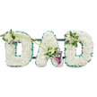 A beautifully composed DAD funeral floral tribute dominates this image, the letters arranged in a neat row and standing out clearly against a clean white background. Each of the three letters is formed from a dense covering of pristine white chrysanthemums, their compact blooms pressed closely together to create an even, cushion-like surface. The petals appear soft and slightly feathery at the edges, giving the arrangement a gentle, comforting texture that speaks of peace and tender remembrance. Around the outside of every letter runs a ruffled emerald green satin ribbon, its rich colour and subtle sheen providing clear definition and a fresh contrast to the white flowers. Small glimpses of a dark framework and connecting bars can be seen from behind, indicating that the tribute is mounted on a sturdy base so it can stand upright during a service at a Stanmore chapel or graveside gathering.   

Carefully placed accent sprays add character and emotional detail. On the first D, at the upper left, a small cluster of white freesia blooms and glossy green leaves softens the edge and introduces the suggestion of fragrance and natural movement, as though a small garden had been tucked into the letter. From this cluster, two long, slender green stems arc gracefully across the tribute towards the middle, guiding the eye towards the A. At their crossing point, near the lower part of the A, sits a striking yet tasteful focal arrangement: two deep purple calla lilies emerge from a nest of white freesia and foliage. Their sculpted, trumpet-like forms and rich hue provide a deeper, more contemplative note to the composition, symbolising profound love and sorrow. The final D carries a smaller, echoing cluster of freesia and greenery on its upper right side, balancing the first spray and completing the design. Together, these details create a serene, heartfelt memorial piece, the sort of bespoke DAD tribute many Stanmore families might choose to honour the memory of a much-loved father.