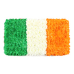 From Flowers Stanmore, this elegant rectangular panel recreates the Irish Tricolour using fresh petals, set against a pure white background. The left stripe is a deep emerald green, formed by a dense carpet of tiny green blossoms-green carnations and chrysanthemums-that give the surface a plush, almost velvety texture. The central stripe is a crisp white, built from tightly clustered white petals that read as a soft, cloudlike band, catching subtle light and adding a sense of calm between the two colours. On the right, a vivid orange stripe appears as a meticulously arranged field of tiny orange flowers, likely marigolds or orange chrysanthemums, with the same tactile depth as the other panels. The entire arrangement is a precise rectangle, mirroring the flag's proportion and emphasising its ceremonial character. The combination of vivid colour and natural texture makes the piece feel handcrafted and celebratory, while the white backdrop sharpens the contrast so the flag reads clearly from a distance and up close. The symbolism is clear: green for Ireland's Catholic and nationalist identity, white for lasting peace between traditions, and orange for the Protestant community-an enduring reminder of unity through shared beauty. This floral tribute would suit articles on Irish identity, St Patrick's Day celebrations, or national holidays, and, in Stanmore, it can be delivered with care to local homes and community spaces, with same-day options available across NW London. A living emblem, it speaks of craft, memory, and the gracious language of flowers.