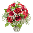 A densely packed, elegant bouquet of red and white flowers is presented in a clear glass vase, set against a pure white background that lends a polished, almost gallery-like feel to the composition. The primary focus is on the sumptuous deep red roses, each bloom with tightly layered, velvety petals spiralling towards the centre, radiating the classic symbolism of romance and devotion. Surrounding them, brilliant red carnations bring a different kind of beauty, their ruffled, multi-layered petals forming rounded, cushiony heads that add softness, volume, and a welcoming richness to the design. Between these bold red flowers, generous sprays of white baby's breath create a light veil, their tiny blossoms scattered like grains of snow, softening the arrangement visually and adding an air of innocence and gentle calm. Tucked among the flowers are glossy dark green rose leaves and rounded eucalyptus foliage in a cooler, silvery tone, bringing depth, structure, and a quiet hint of fresh, green fragrance. The bouquet is shaped into a balanced, dome-like form, suggesting the hand of an experienced florist at Flowers Stanmore, where arrangements are crafted with care for local deliveries around Stanmore, Canons Park, and nearby residential streets. The clear glass vase, filled partway with water, reveals the straight, neatly trimmed stems, underscoring the bouquet's freshness and professional preparation. The lighting is bright and even, without harsh contrast, which highlights the vivid reds, the crisp whites, and the natural greens all at once. It is easy to imagine this bouquet on a sideboard in a Stanmore home, gracing an anniversary dinner table, or greeting a loved one returning from a day out, a timeless expression of love, celebration, and heartfelt appreciation.