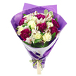 A richly coloured bouquet is photographed upright against a spotless white background, its rounded crown of flowers and neatly tapered stems creating a graceful, balanced silhouette. In the centre of the arrangement, cream-white roses open in gentle spirals, their velvety petals lending a sense of calm sophistication that instantly draws the eye. Encircling them, deep magenta carnations gather in luxuriant clusters, their tightly ruffled petals forming plush, textural blooms whose vibrant fuchsia shades bring energy and celebration, reminiscent of a special dinner or family gathering in Stanmore. Threaded between these main flowers, white alstroemeria extend outward on slender stems, each blossom decorated with fine pinkish-red streaks and dark stamens that introduce delicate, intricate detail. Around the blossoms, lush green foliage, including several leaves with variegated pale edges, fills out the arrangement and enhances its natural charm, echoing the greenery of Canons Park and the tree-lined streets leading towards Stanmore Broadway. The stems are drawn together at the base in a narrow bundle, supported by an inner wrapping of crisp white paper that forms a clean, structured collar beneath the blooms. Over this, a translucent, softly crinkled layer of purple cellophane or tissue enfolds the bouquet, its violet hue adding depth and a shimmering, almost festive effect when it catches the light. A bright, iridescent green satin ribbon is tied snugly around the base, forming a neat bow that secures the wrapping. From the knot dangles a small, rectangular light brown gift tag, perfectly placed for a handwritten note of love, congratulations, or sympathy. The design, thoughtfully composed in the style of Flowers Stanmore, radiates joy, care, and quiet refinement, well suited to birthdays, anniversaries, and everyday gestures delivered across Stanmore and nearby neighbourhoods.